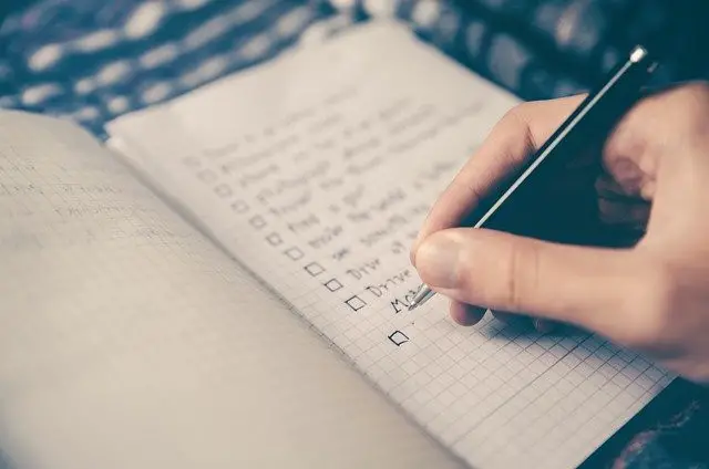 Setting up a home office checklist - notebook with checklist