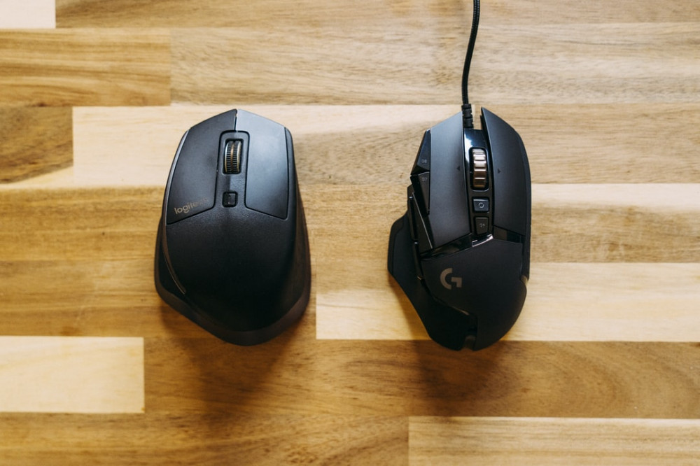 Benefits of ergonomic mouse - 2 black logitech mice on table