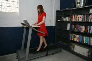 Woman on walking treadmill