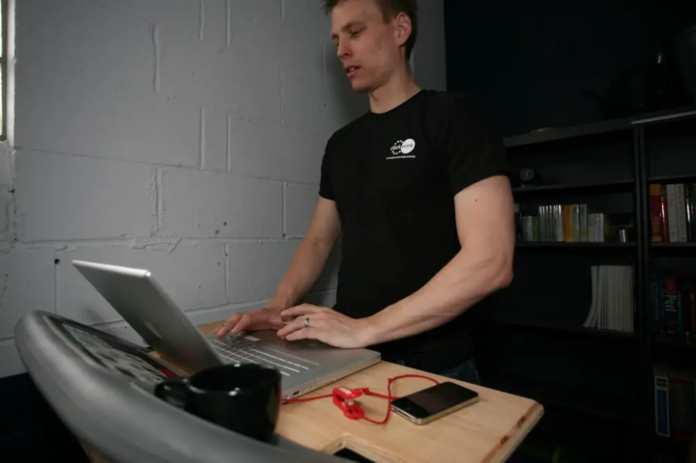 What To Wear On A Treadmill Desk - Man standing at treadmill desk