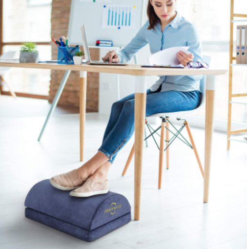 Are Footrests Worth It? - Woman at desk resting on ameriergo foam footrest