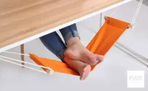 Choose A Foot Hammock - Feet resting on under-desk orange foot hammock